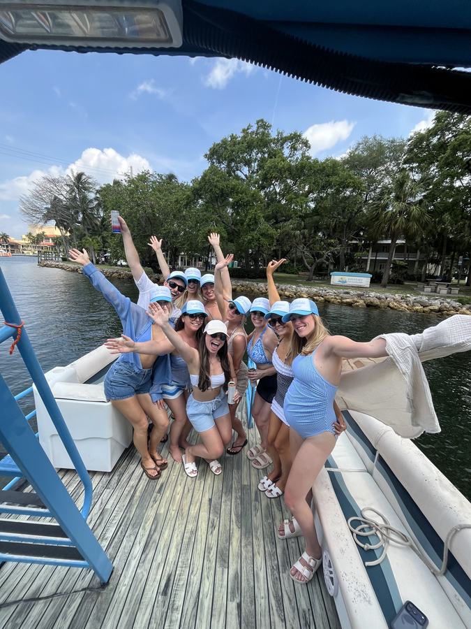 Bachelorette party blue hats Fort Lauderdale pontoon charter Boozy Barge